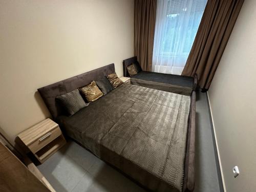 Postel nebo postele na pokoji v ubytování Aparthotel Olympland
