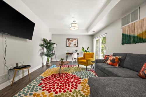 a living room with a couch and a rug at Cozy Getaway Near City Center in Salt Lake City