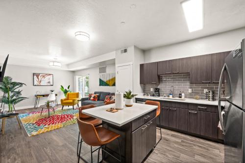 an open kitchen and living room in a apartment at Cozy Getaway Near City Center in Salt Lake City