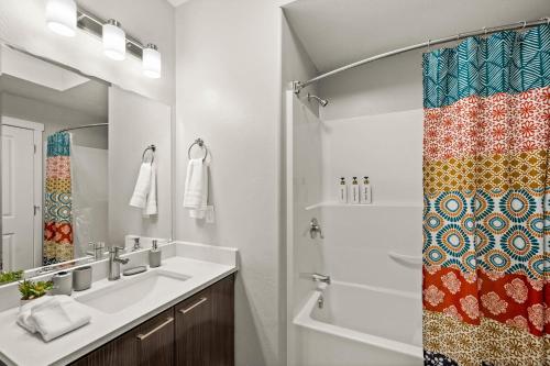 a bathroom with a sink and a shower at Cozy Getaway Near City Center in Salt Lake City