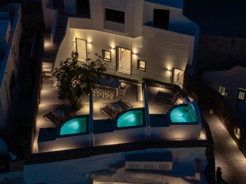 an aerial view of a building at night at NEW Yiota Collection 4 Suites & 4 Prive Jacuzzi in Megalokhori