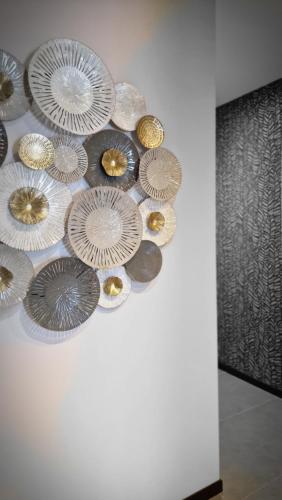a bunch of paper plates hanging on a wall at My home in Sarzana in Sarzana