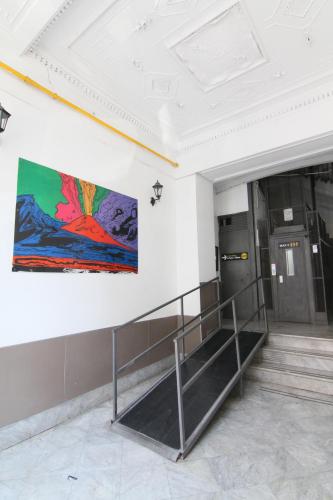 a painting on a wall in a building at AuRoom in Naples