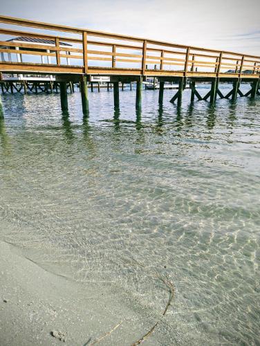 a wooden pier over the water near the beach at Harbor Inn in Wrightsville Beach