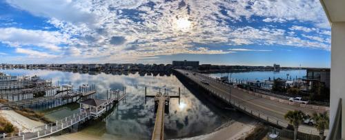 a view of a river with a bridge at Harbor Inn in Wrightsville Beach