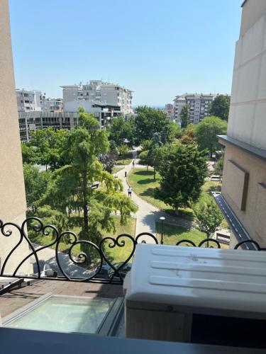 a balcony of a building with a view of a park at Alo Alo Apartman 6 in Kruševac