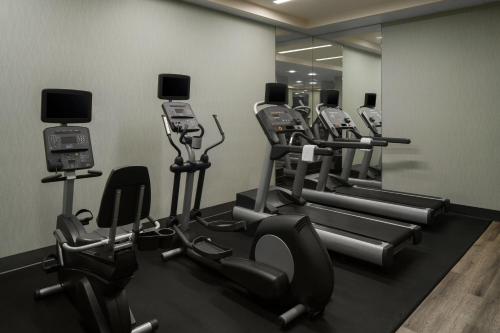 a gym with a row of treadmills and machines at Courtyard by Marriott San Diego Gaslamp/Convention Center in San Diego