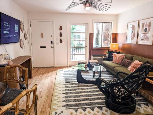 a living room with a couch and a table at The Tiki Suite 2BR 2BA in Columbia