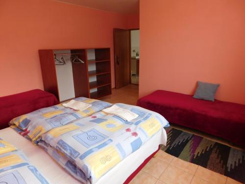 Postel nebo postele na pokoji v ubytování Apartmany Tania