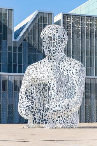 a large sculpture in front of a building at A Orillas del Pilar con parking in Zaragoza
