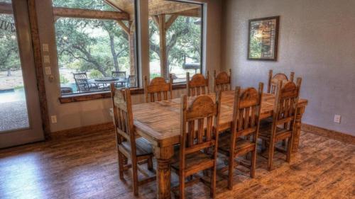 a dining room with a wooden table and chairs at Fryars' Villa in Concan