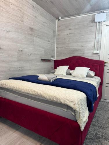 En eller flere senge i et værelse på Ștefan Hotel