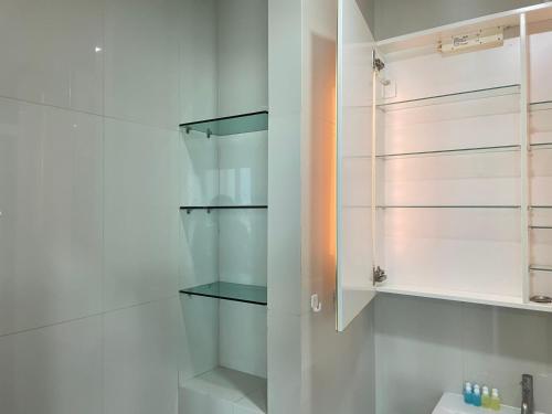 a bathroom with white cabinets and a sink at The Base Central Pattaya Super condo in Pattaya Central