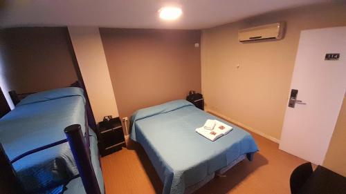 Hotel Alto Paranaにあるベッド