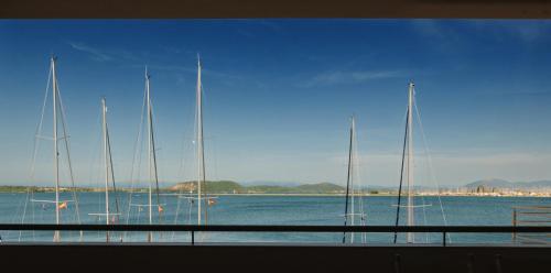 a group of sailboats sitting on the water at Ionis Seafront Suite in Preveza