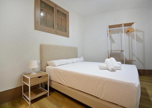 Katil atau katil-katil dalam bilik di Apartamento Luz Divina
