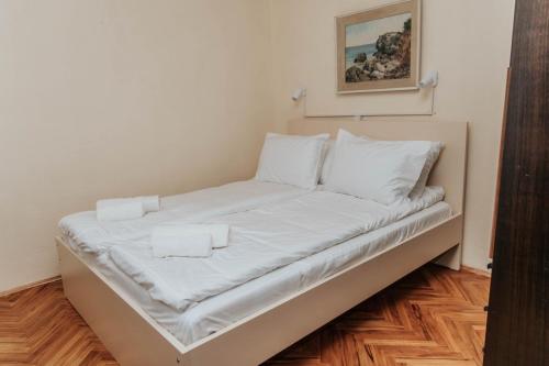 Una cama o camas en una habitación de Apartman Magic