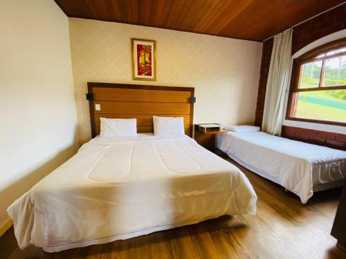 Postel nebo postele na pokoji v ubytování Paraty Hotel Fazenda & Spa