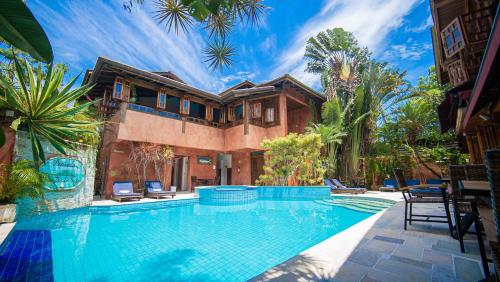 an image of a house with a swimming pool at Pousada Montão do Trigo Juquehy in Juquei