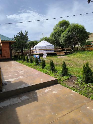 a gazebo with a tent in a yard at Kolsay Aisha in Saty