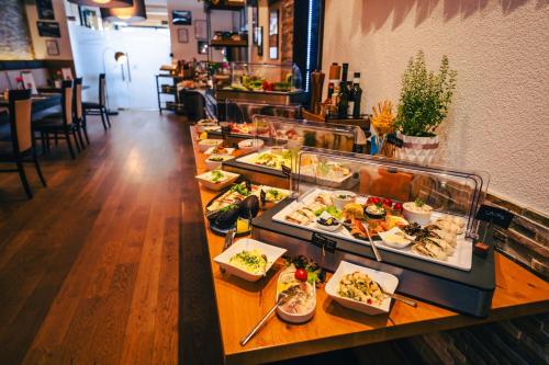 a buffet line with many different types of food at Patrix Hotel, Restaurant, Bar in Frankenburg