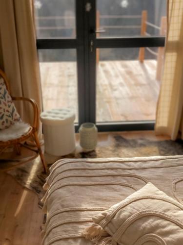Una cama o camas en una habitación de Domek DOMiarki