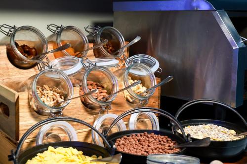 a bunch of bowls of food on a table at Mikes Kanarium City Hotel in Larnaka
