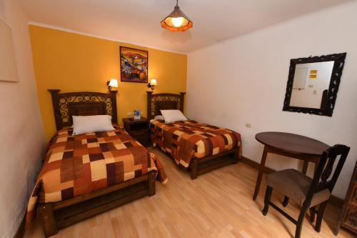 Letto o letti in una camera di Hostal Mallqui