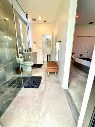 a bathroom with a shower and a sink at Tropical Studio in Miami