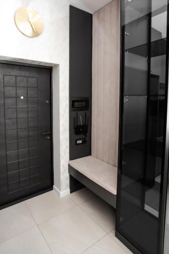 a black closet with a black door in a room at Guesthouse - 3 room in Sumqayyt