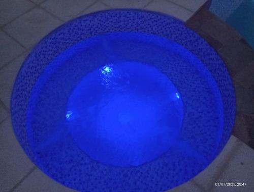 a blue bowl sitting on top of a floor at A Mi Manera Apart in Merlo