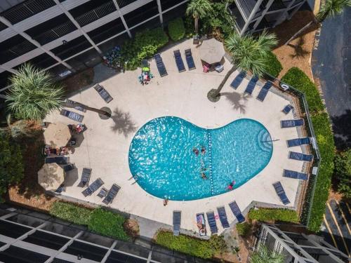 an overhead view of a swimming pool at a resort at Sunset Dunes Direct Beach Access in Hilton Head Island