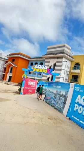 a group of people walking in front of a building at Porto Matrouh unique Chalet in Marsa Matruh