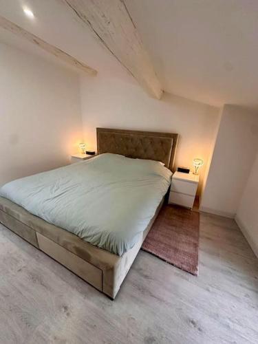 Postel nebo postele na pokoji v ubytování la Résidence Jacquinot