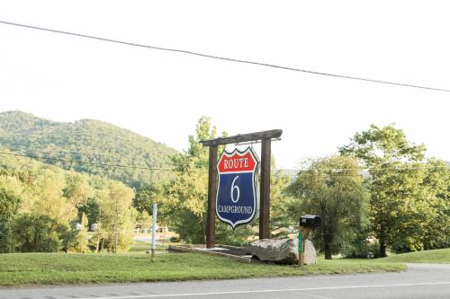 a sign for a motel on the side of a road at Route 6 Campground in Gaines