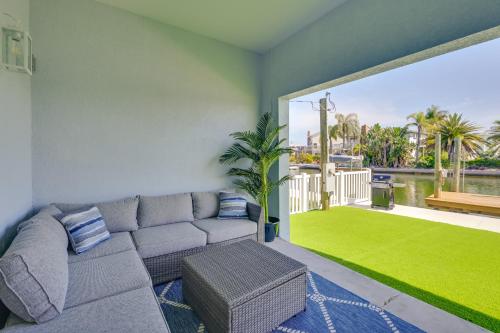 a living room with a couch and a large window at Waterfront Hudson Townhome with Dock Access! in Hudson