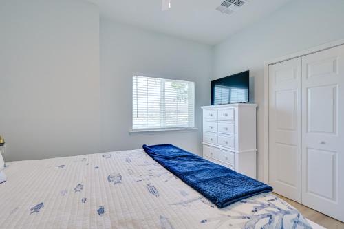 a white bedroom with a bed and a dresser at Waterfront Hudson Townhome with Dock Access! in Hudson