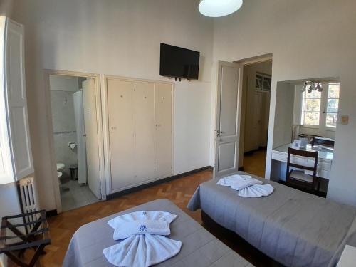 Postel nebo postele na pokoji v ubytování Hotel Plaza