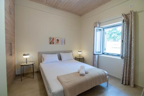 Ένα ή περισσότερα κρεβάτια σε δωμάτιο στο Nina's Summer Home