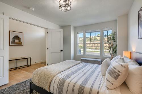 a bedroom with a bed and a window at Cedar City Retreat - 18 Mi to Zion National Park! in Cedar City