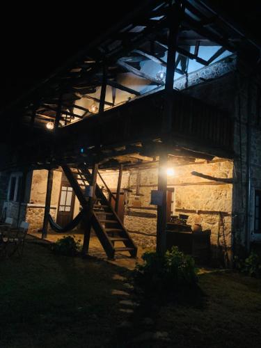a building with a slide in front of it at night at Χαγιάτι in Psarades