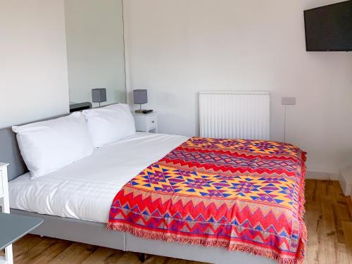 Ένα ή περισσότερα κρεβάτια σε δωμάτιο στο Flat in Glastonbury 10