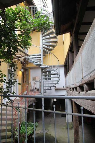 a spiral staircase in the side of a building at Apartment 180 qm BIBERBURG, in der romantischen Rödermühle an der Fränkischen Saale in Deutschlands Mitte, 8 km zur A7 in Hammelburg