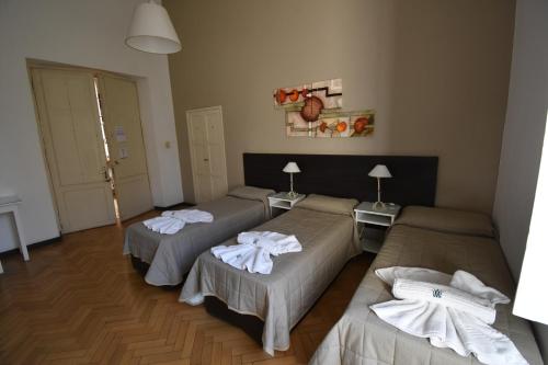 Postel nebo postele na pokoji v ubytování Hotel Plaza