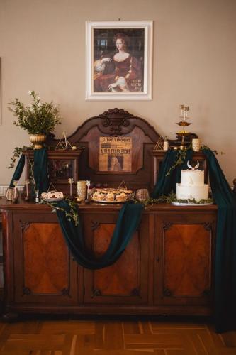 a table with a cake on top of it at Pension Zámek Rudník in Rudník