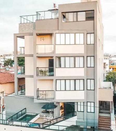 a rendering of a building with a swimming pool at Flats no centro de Porto de Galinhas próximo à praia opções com e sem piscina privativa in Porto De Galinhas