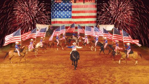 a group of people on horses holding american flags at Summit Pool Lodge in Little Cove