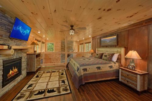 a bedroom with a bed and a fireplace at Poolin Around in Waldens Creek