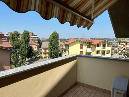 a balcony with a view of a city at Appartamento Antony's House in Limbiate