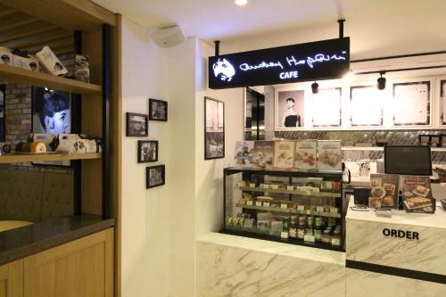 a cosmetics shop with a sign on the wall at Hotel Migliore Seoul in Seoul